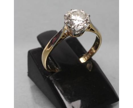 A SOLITAIRE DIAMOND RING, the brilliant cut stone of approximately 0.7cts, claw set to a plain shank, stamped 18ct, PLAT., si