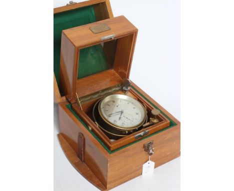 A MARINE CHRONOMETER signed Thomas Mercer 22104, the 4" silvered dial with Roman numerals, state of wind and seconds dials, i
