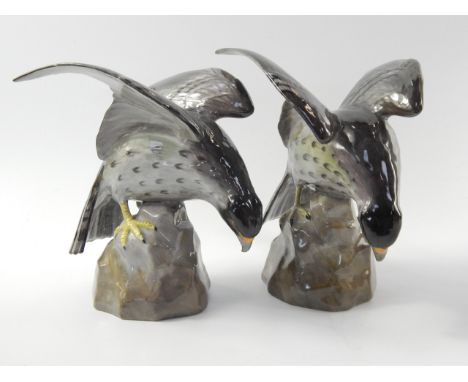 A pair of Copeland Spode porcelain figures of Falcons, mid 20thC, modelled perched on rocks, printed marks, with a letter fro