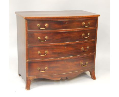 A George III mahogany bow front chest of drawers, with four long graduated drawers, raised on splayed feet, 99cm long, 54cm d