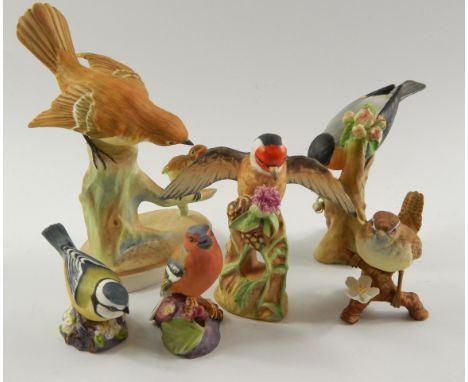 A group of bisque porcelain figures of birds, comprising; Crown Staffordshire Flycatcher and young, Goldfinch and Bullfinch, 
