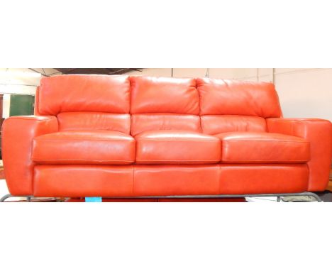 A red hide three seater sofa, 220cm long, 93cm deep, 87cm high.