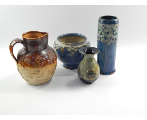 A Royal Doulton stoneware jardiniere, with a floral and scrolling border against a blue ground, 15cm high, cylindrical vase d