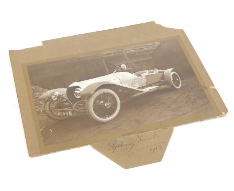 A period photograph of an early open tourer automobile, signed Sydney Smith 1913.  NB. Hub caps marked SS