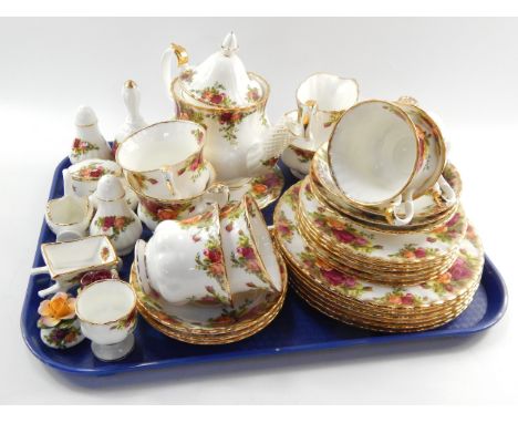 A Royal Albert porcelain part tea service decorated in the Old Country Roses pattern, comprising; teapot on stand, cream jug,