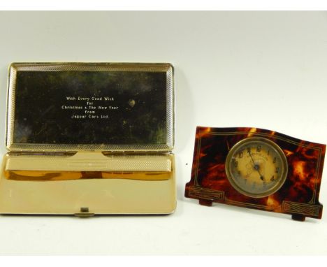 A Michelin Easel table clock, with faux tortoiseshell inlaid frame and a Jaguar Cars cigarette case, (2).