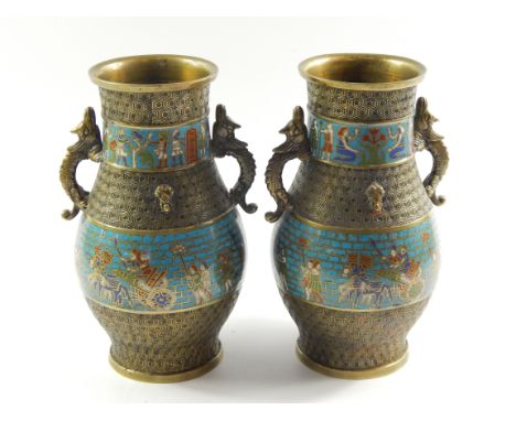 A pair of brass and champleve enamel vases, late 19thC, of twin dragon handle, baluster form decorated with bands of Assyrian