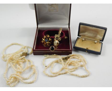 A quantity of lady's jewellery, comprising; a Nivada 9ct gold circular cased wristwatch on a plated strap, 9ct gold and caboc