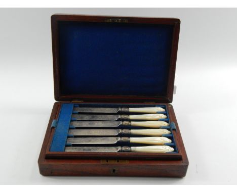 A set of six Victorian plated fruit knives and forks,  foliate engraved with mother of pearl handles, cased, (A/F)