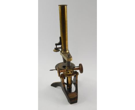 A Victorian brass and iron Pharmacy Microscope, circa 1860, base bearing oval plate for Evans, Lescher & Evans, London, engra
