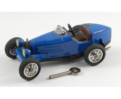 A modern Shuco Studio IV Bugatti 35B clockwork model car.