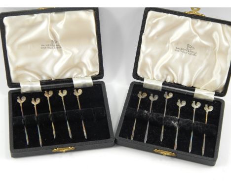 Two sets of silver cocktail sticks, with cockerel terminals, one stick lacking, cased, Walker & Hall, Birmingham 1956-57, (A/