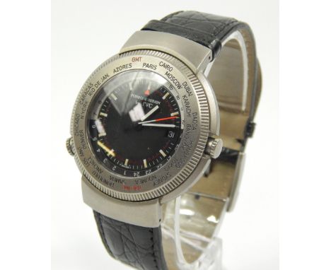 An IWC Porsche design titanium wristwatch, with a black dial and black leather strap.