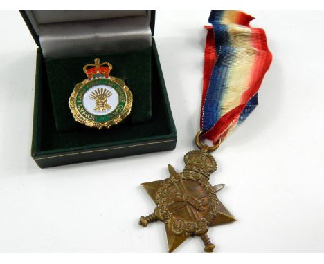 A 1914-15 Star to Pte W G Bell, A Cycling Corps 4640, and a modern Women's Land Army badge.