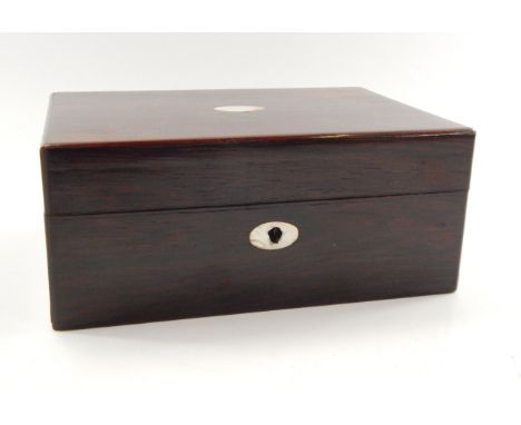 A Victorian rosewood and mother of pearl inlaid sewing box, with a green silk interior, 25cm long, 17cm deep, 10.5cm high.