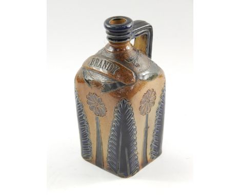 A Doulton Lambeth stoneware spirit flask, late 19thC, reserve banner for Brandy, above a stylised flower and acanthus leaf de