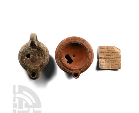 Circa 2nd century A.D. Comprising: one in greyware with broad shoulder, facing mask to the discus; one squat with beaded rim 