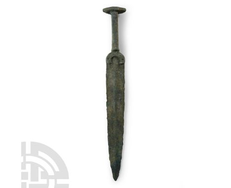 12th century B.C. The blade with raised central shallow rib and with separated crescent quillon, fitted with an integral rect