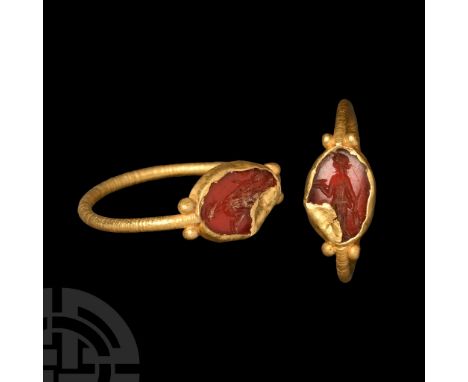 2nd-3rd century A.D. Slender hoop with pairs of granules flanking the ellipsoid cell with inset carnelian intaglio of Diana s