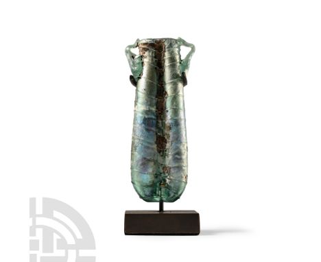 3rd-5th century A.D. Comprising two conjoined tapering tubular cells, with applied handles at the shoulder, decorated with ap