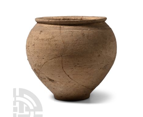 2nd-3rd century A.D. Bulbous in profile with narrow base and sharply everted rim to the mouth; repaired.  77 grams, 86 mm (3 