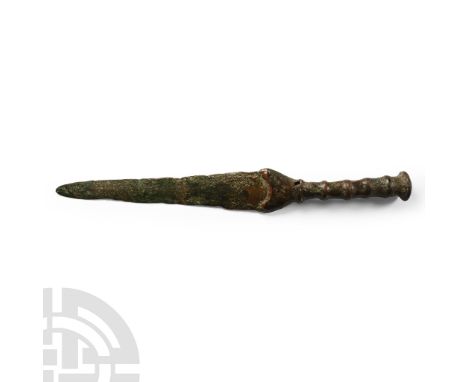 13th-7th century B.C. Comprising a two-edged leaf-shaped lentoid-section blade, crescentic lower guard, ribbed hilt and domed