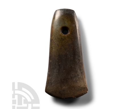Neolithic Period, 5500-2400 B.P. Polished and worked on all sides to a symmetrical, almost trapezoidal shape flaring slightly