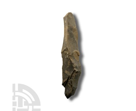 Neolithic Period, circa 6000 B.P. Triangular in section with narrow square butt and broad curved edge.  125 grams, 18.5 cm (7