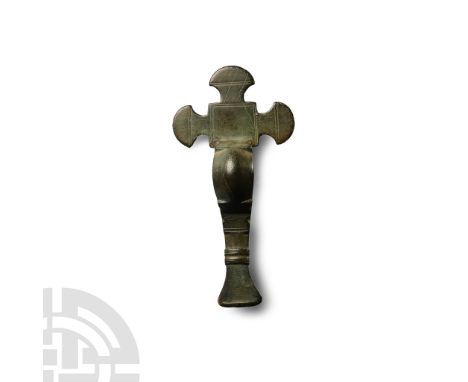 6th century A.D. With square headplate and three pelta-shaped radiating plaques with incised linear detailing, deep bow with 
