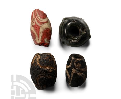 Circa 5th-7th century A.D. Mainly fusiform types with marvered trails.  31 grams total, 23-25 mm (1 in.). [4, No Reserve] Fou