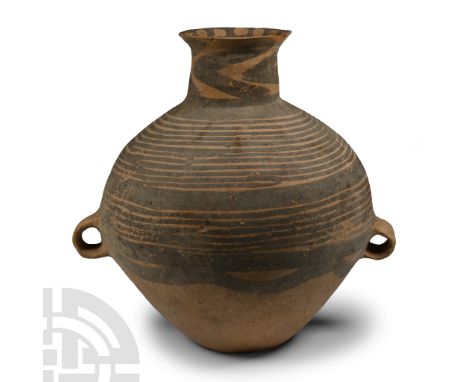 Neolithic Period, 3rd millennium B.C. Comprising a bulbous body with two small loop handles below the equator, flat base, low