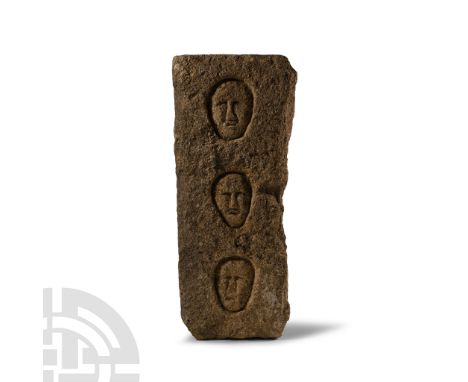 Circa 1st century B.C.-1st century A.D. or later. Rectangular in section, obverse with three carved facing piriform masks, in