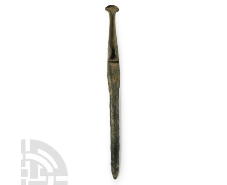 13th century B.C. With lentoid-section blade, tongue-shaped in plan, with integral tapering hilt with flared finial, lateral 