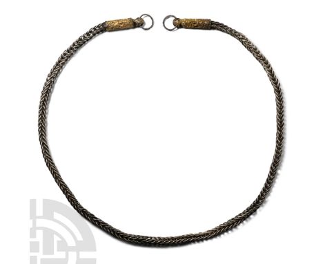 Circa 10th-12th century A.D. Openwork trichinopoly chain with D-section beast-head terminals each with granule and filigree d