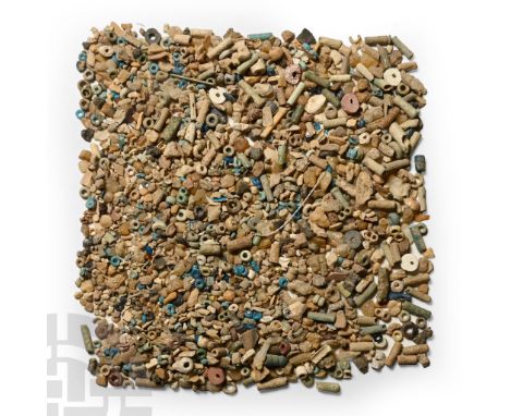 Late Period, 664-332 B.C. Including seed and tubular beads, and other items.  27 grams total, 1-10 mm (1/8 - 3/8 in.). [No Re