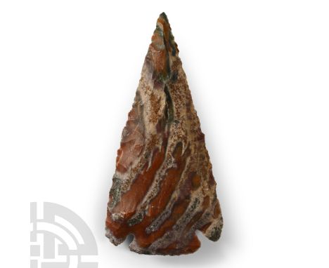 Circa 1st millennium A.D. Triangular in plan with spurs to the rear, banded pattern in the jasper; inked label 'NAI94'.  41.1