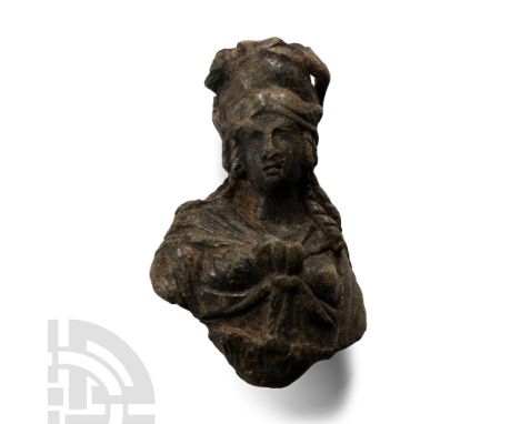 2nd-3rd century A.D. Modelled in the round with tall diadem, hair braided and hanging in hanks to the shoulders, palla tied b