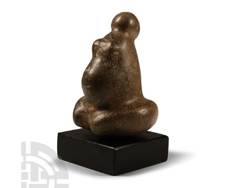 Neolithic Period, circa 6th-4th millennium B.P. or later. Modelled in the round as a figure of a pregnant woman sitting uprig