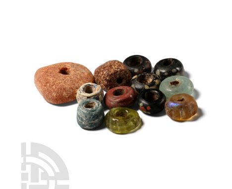 Circa 5th-7th century A.D. Including annular, lenticular, tubular and other types, one possibly a Hebron bead.  20 grams tota