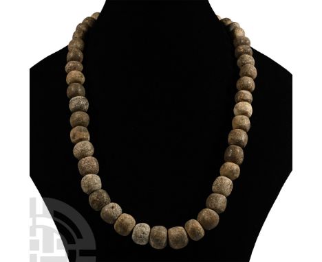 Pleistocene Period, 2.6 million-11,700 years B.P. Restrung using recently polished Mammuthus primigenius bone beads. See Guid
