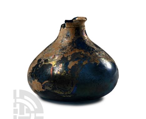 1st century A.D. Miniature glass jar with bulbous body, dimple base, short neck and flaring rim. Cf. Auth, H., Ancient Glass 