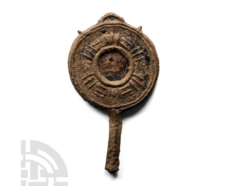 4th-6th century A.D. Comprising a lead-alloy circular rim with raised radiating hatching, loop above and short lozenge-sectio