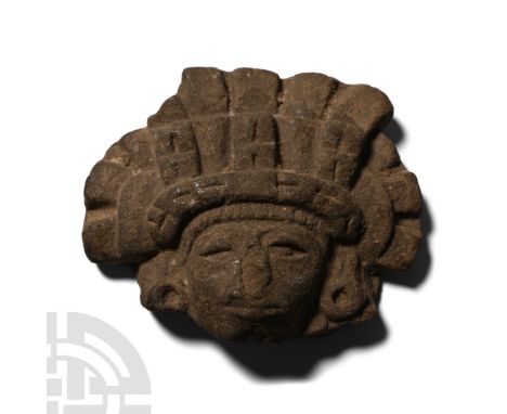 Circa 250-400 A.D. Mask with elaborate tiered headdress and ear-plugs; modelled in the half-round; old label to reverse '3012