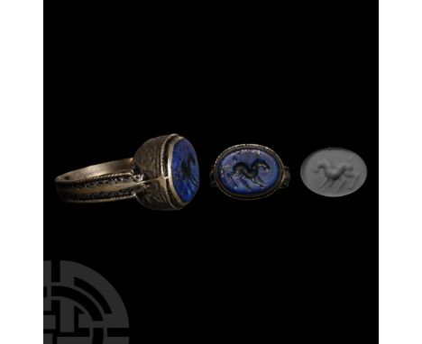 5th-7th century A.D. and later. Ellipsoid lapis lazuli cloison with intaglio horse; set in a later stepped silver cell, D-sha