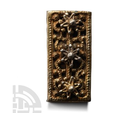 Circa 12th-15th century A.D. Rectangular in plan with openwork strap to the reverse, three silver-gilt rosettes on a field of