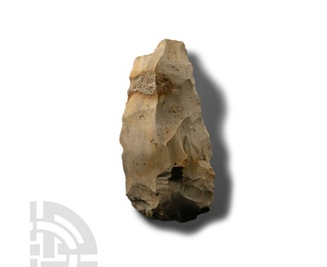 Neolithic Period, circa 6000 B.P. Triangular in section with irregular butt, curved cutting edge; marked 'SP' on two faces fo