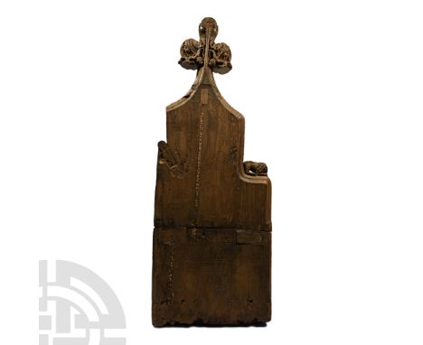 East Anglia, 15th century A.D. Carved finial for a church pew with scooped arm-rest and rear slot for shelf; tapering upper s