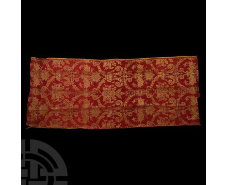 Late 16th century A.D. Rectangular swatch of red and gold fabric with embroidered vegetal motifs.  188 grams, 55 x 132 cm (21