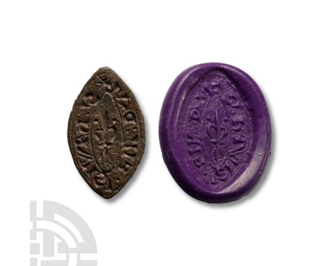 13th century A.D. Vesica-shaped in plan with lug handle and low-relief leaf motif to reverse; obverse with incuse fleur-de-ly