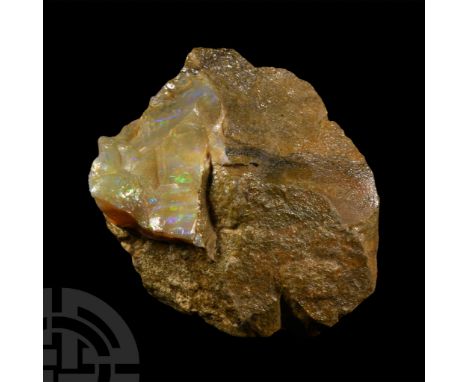 Displaying iridescent milk-opal in a pale creamy-brown matrix, collection number 625.  105 grams, 65 mm (2 1/2 in.). [No Rese